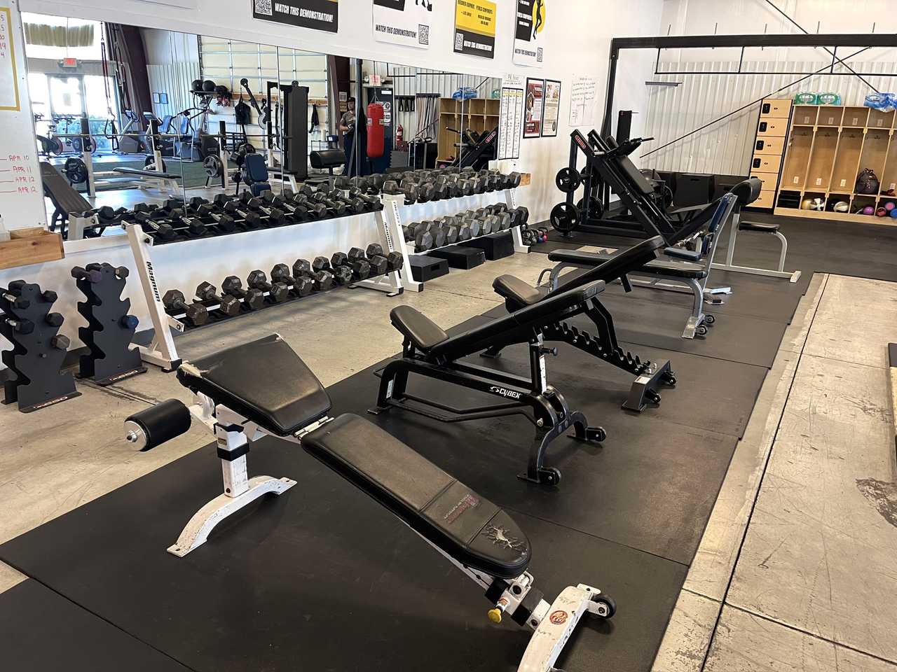 Dumbbell racks with adjustable benches.